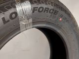 a close up of a tire on a white surface