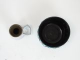 two cups and a saucer sitting on a table