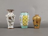 three vases sitting next to each other on a table