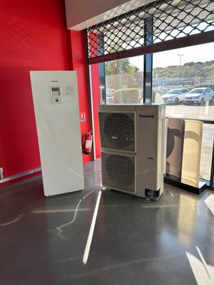 an image of a room with a refrigerator and a refrigerator freezer