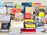 a lot of books that are sitting on a table