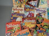 a lot of comic books that are on the table