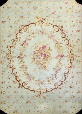 an antique rug with a floral design on a black background