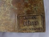 an image of a bronze statue of a horse with a plaque on it ' s back