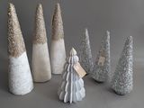a lot of christmas trees that are sitting on a table