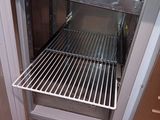 an image of an open oven door in a kitchen