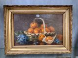 un tableau représentant des oranges dans un panier posé sur une table