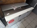 an image of a kitchen with a refrigerator and a sink