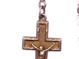 pair of silver and gold cross dangle earrings on a white background