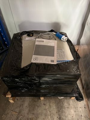 a pile of electronic equipment sitting on top of a black bag