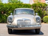 a silver car that is parked in the parking lot