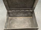 a small metal box that is open on the floor