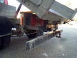 a dump truck that is parked on the side of the road