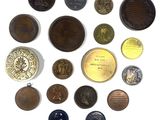 an image of a collection of old coins on a white surface