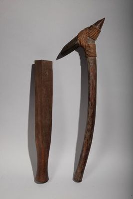 two pieces of wood are sitting next to each other on a white surface