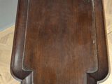a wooden table with a wooden top on a wooden floor