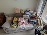 a couch that has a lot of stuff on it