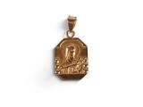 a gold plated pendant with an image of the virgin and child