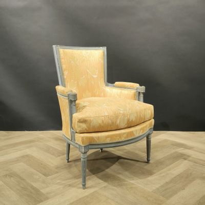 an image of a yellow chair sitting on top of a hard wood floor