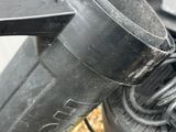 a close up of a blow dryer with a hose attached to it