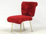 an image of a red chair with gold legs
