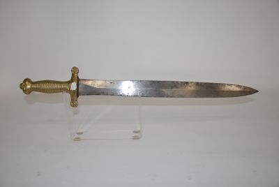 a knife that is on display on a clear stand