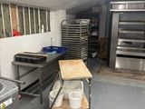 an image of a commercial kitchen with a lot of cooking equipment