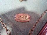a close up of a suitcase with a tag on it