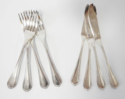 four forks and a spoon on a white surface