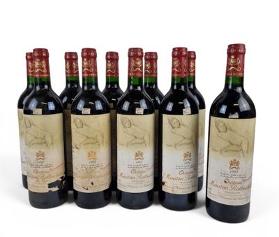 six bottles of wine are lined up on a white surface