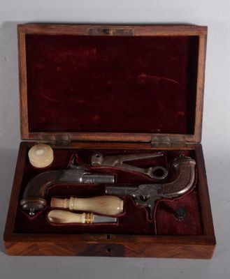 a wooden box with a set of tools inside of it