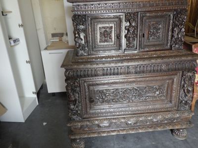 a very old wooden chest in the middle of a room