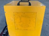 a close up of a yellow box sitting on top of a floor