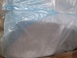 a large bag of plastic sitting on top of a cardboard box