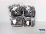 two pairs of boxing gloves that are wrapped in plastic