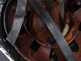 a close up of a helmet with a leather strap