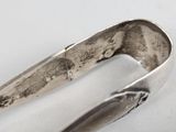 a spoon and a spoon rest on a white surface
