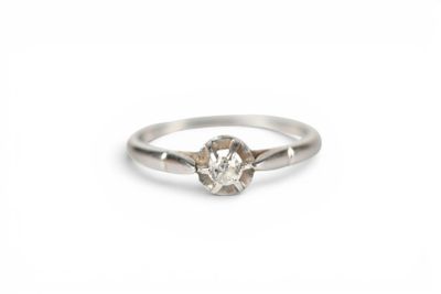 a white gold engagement ring with a single diamond