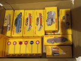 a box full of toy cars that are sitting on a table