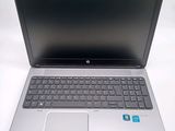 an open laptop computer sitting on top of a white table