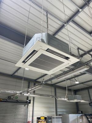 a air conditioner hanging from the ceiling in a building