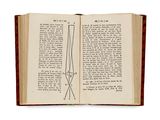 an open book with a drawing of a pair of scissors on top of it