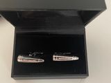 pair of fountain pens in a black box on a white surface