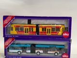 two toy trains that are in the same box