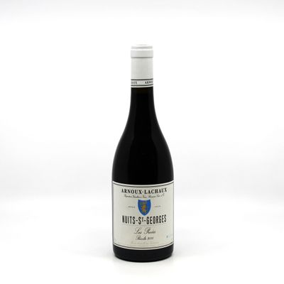 a bottle of wine that is sitting on a table