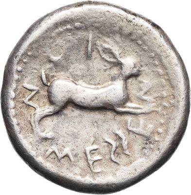 a close up of a silver coin with a deer on it