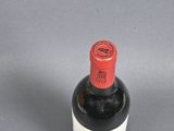 a bottle of wine that is sitting on a table