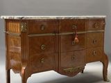 a marble top chest of drawers on a stand