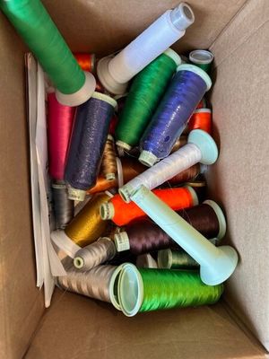many spools of thread in a box