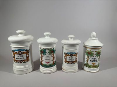 three white ceramic containers with different designs on them sitting on a table